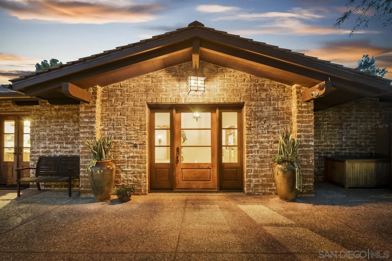 6101 Camino Selva Rancho Santa Fe, CA 92067 - Photo 3 of 35 a front view of a house with a garage