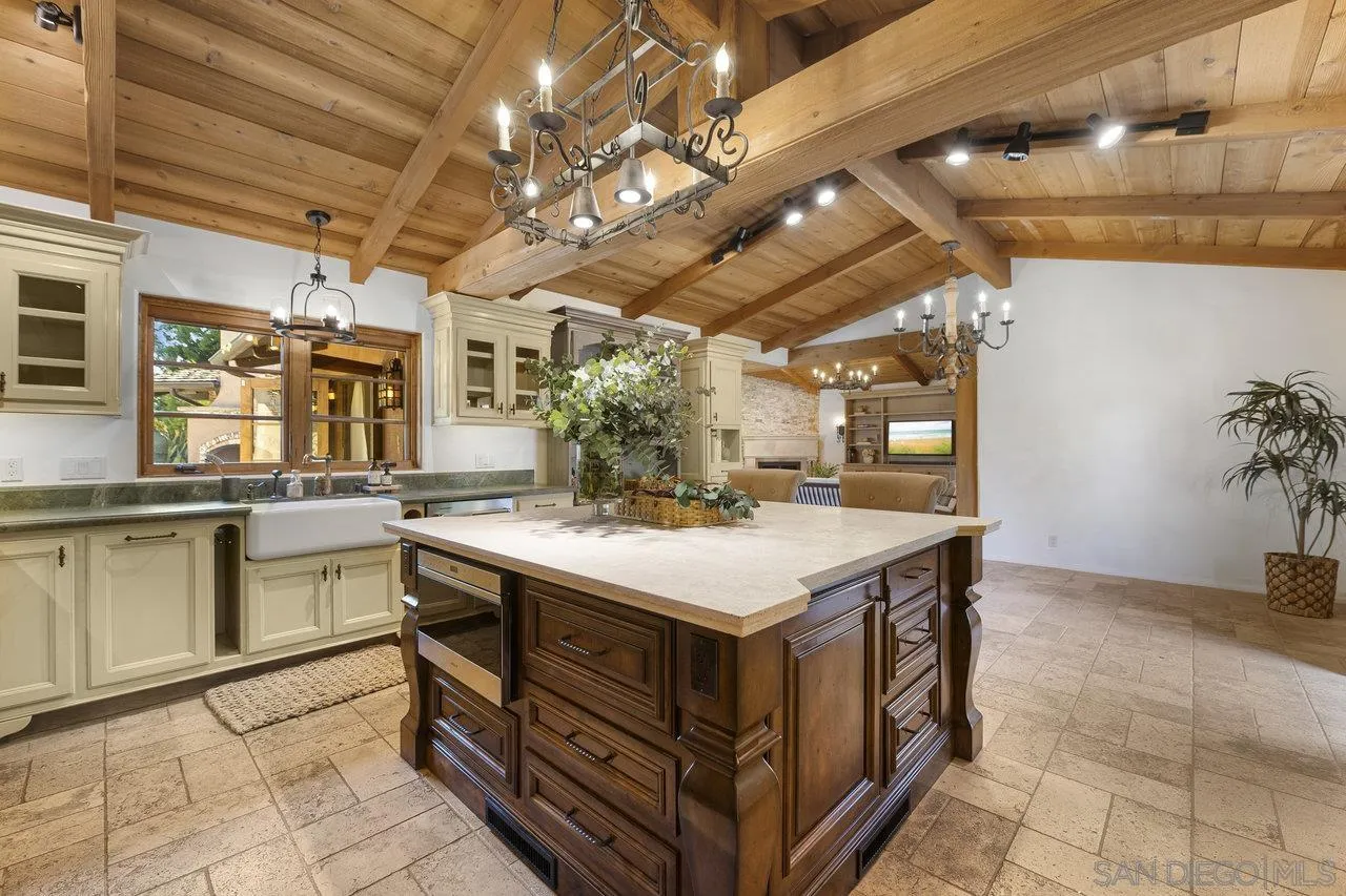 6101 Camino Selva Rancho Santa Fe, CA 92067 - Photo 9 of 35 a kitchen with a stove and a refrigerator