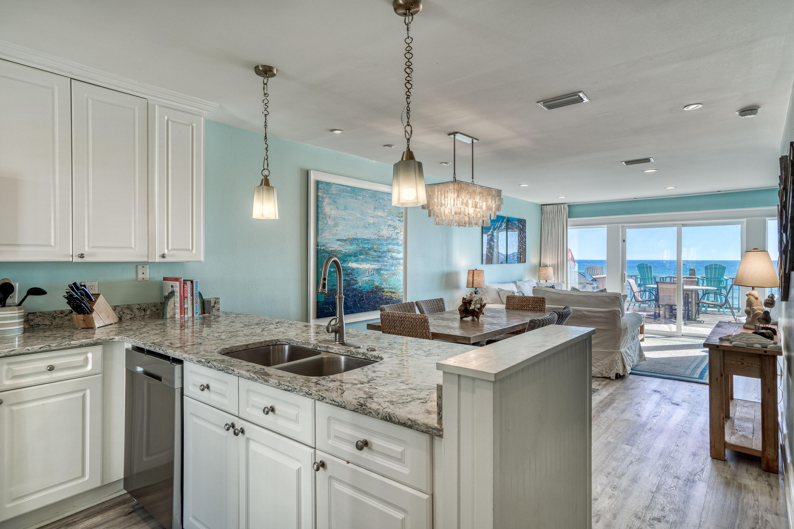 681 Eastern Lake Road, Unit 3 Santa Rosa Beach, FL 32459 - Photo 8 of 64 a kitchen with granite countertop a sink a counter space appliances and cabinets