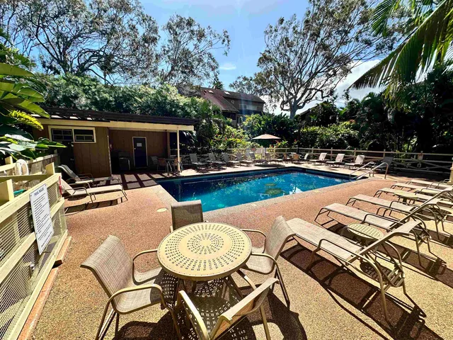 a view of a swimming pool with a patio