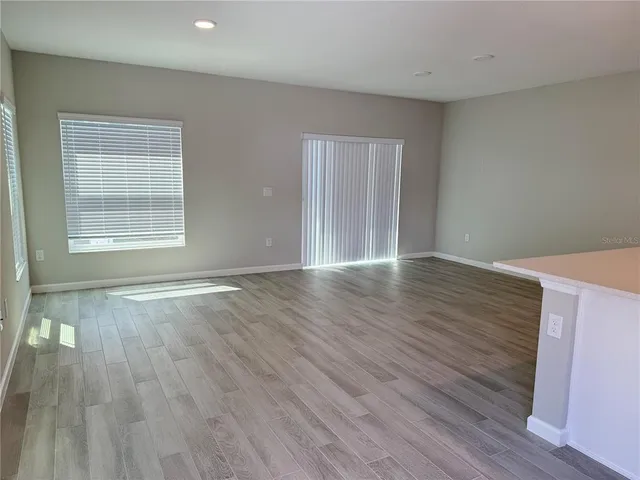 a view of a kitchen with a sink and a stove top oven