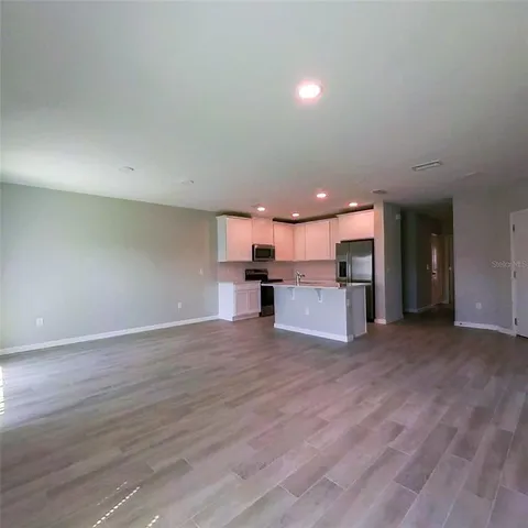 a bathroom with a double vanity sink mirror and shower