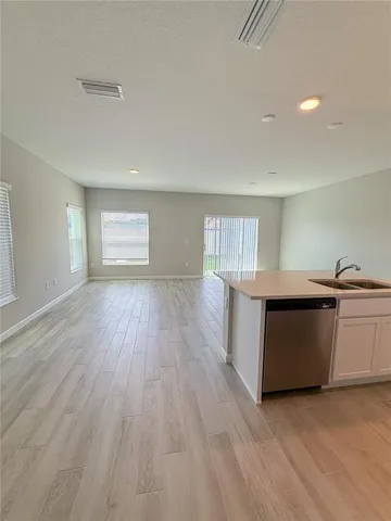 a bathroom with a toilet sink vanity tub and shower