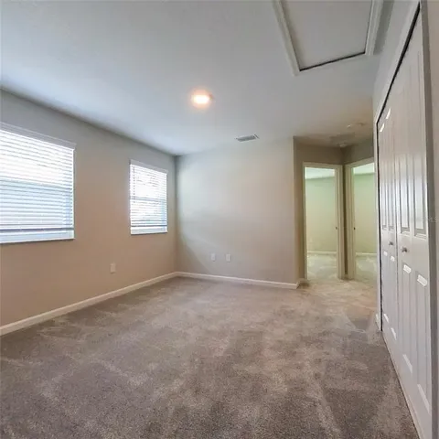 a kitchen with a refrigerator and a stove top oven