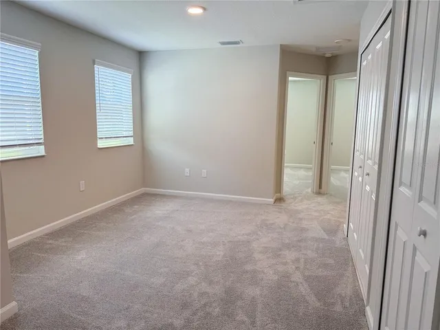 a bathroom with a double vanity sink mirror and shower