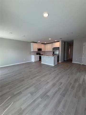 a bathroom with a toilet sink a mirror a bathtub and shower