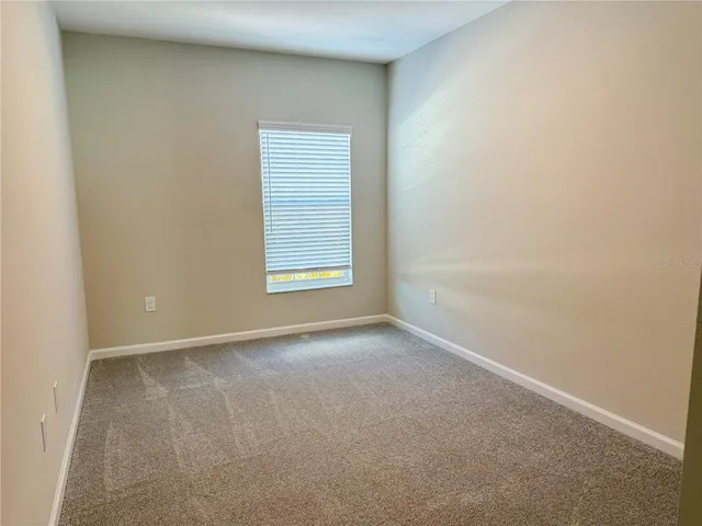 a spacious bathroom with a double vanity sink and a mirror