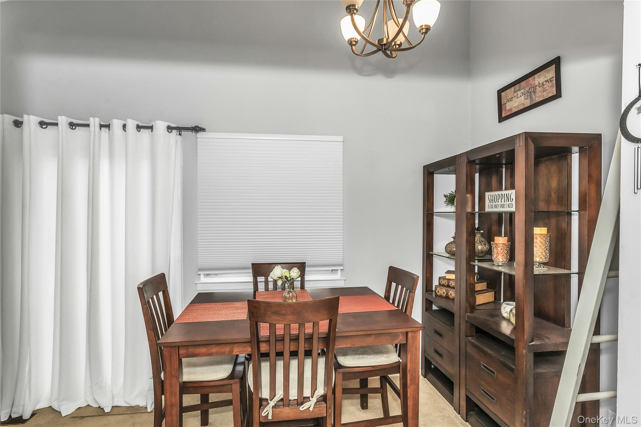 650 Newbridge Road, Unit 9 East Meadow, NY 11554 - Photo 4 of 9 a view of a dining room with furniture