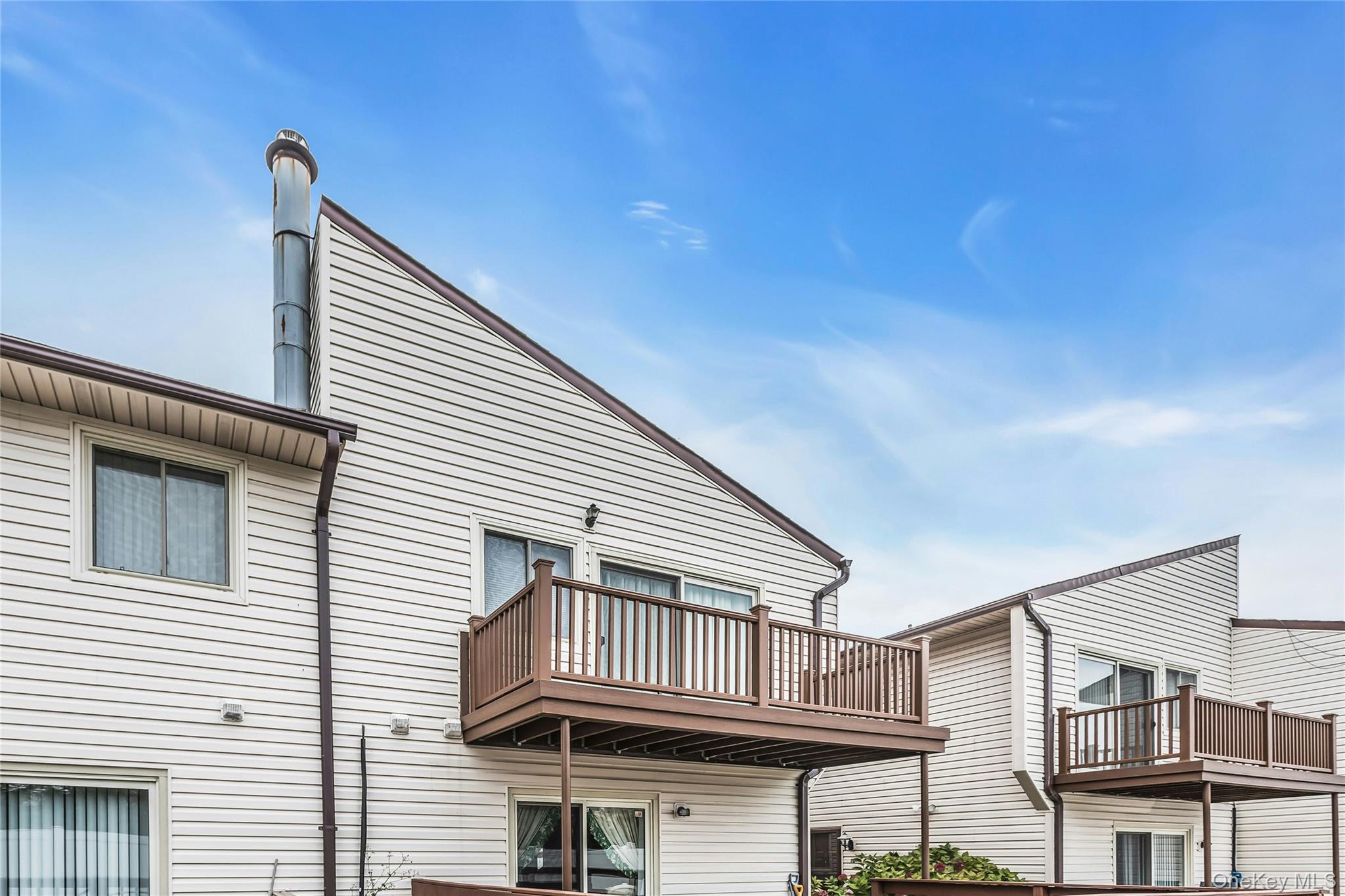 650 Newbridge Road, Unit 9 East Meadow, NY 11554 - Photo 9 of 9 a view of a house with balcony
