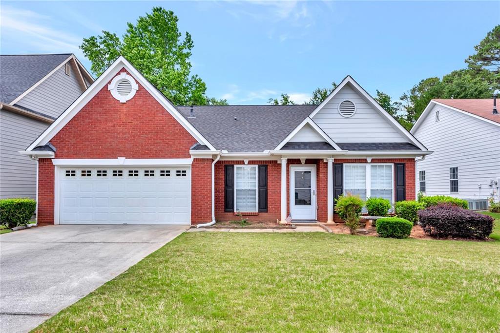 615 Rams Way Tucker, GA 30084 - Photo 1 of 1 a front view of a house with garden