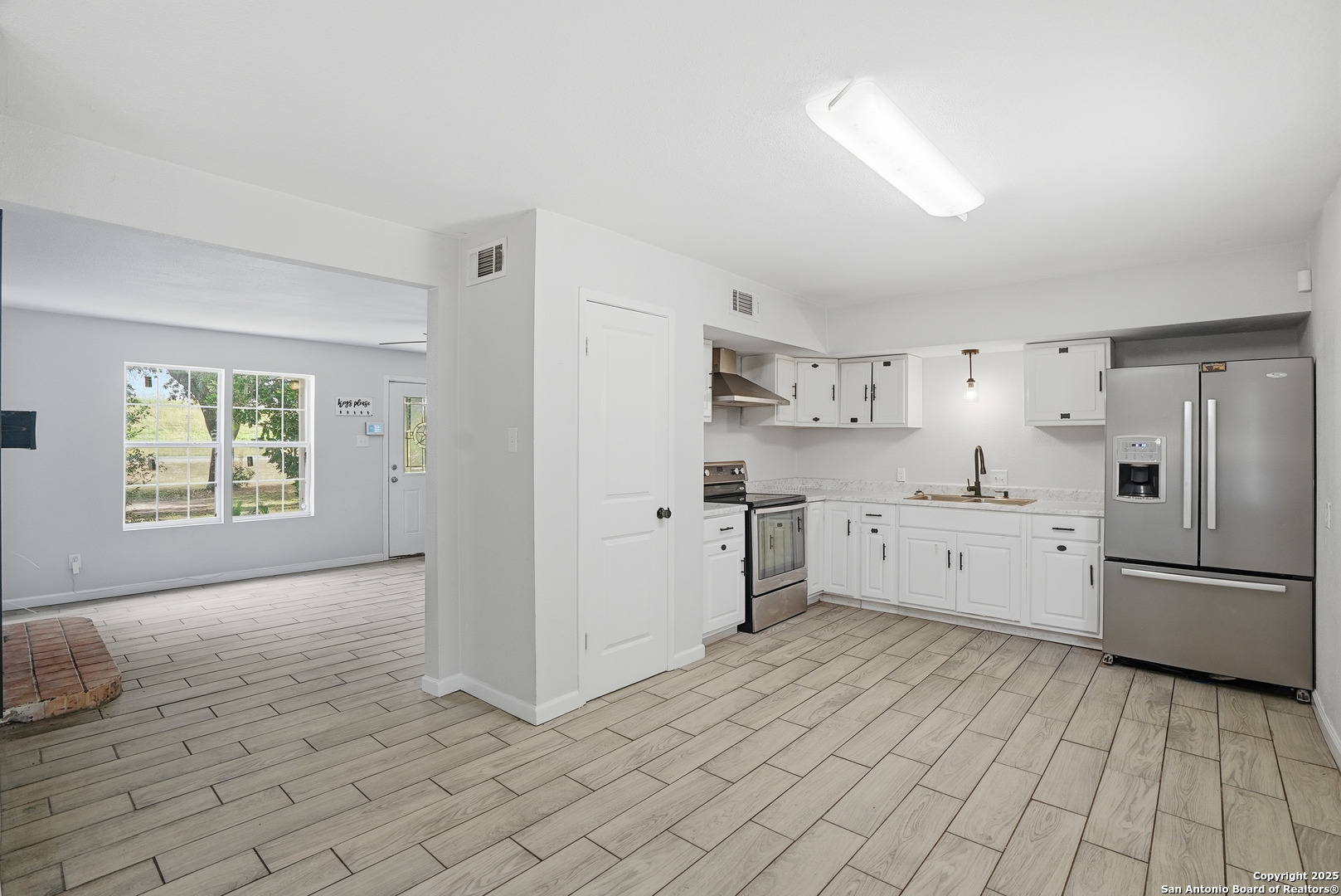 807 Northeast Frontage Road Beeville, TX 78102 - Photo 12 of 49 a kitchen with stainless steel appliances cabinets a sink and a window