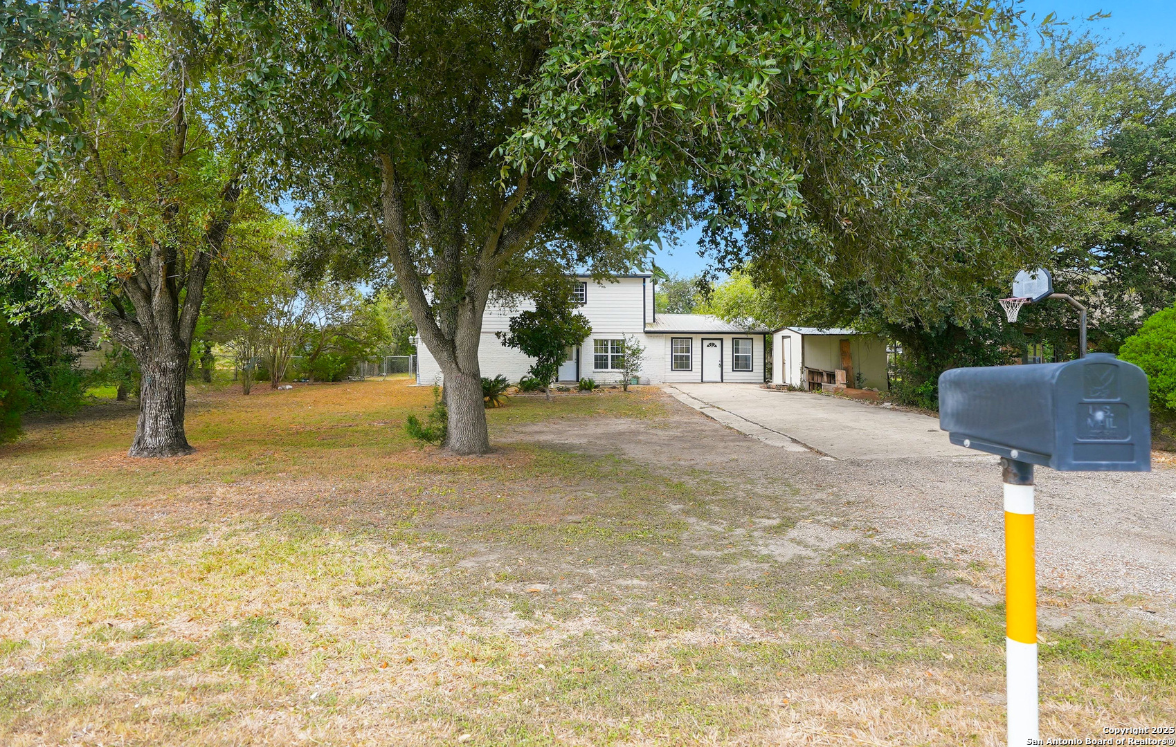 807 Northeast Frontage Road Beeville, TX 78102 - Photo 35 of 49 a house with trees in front of it