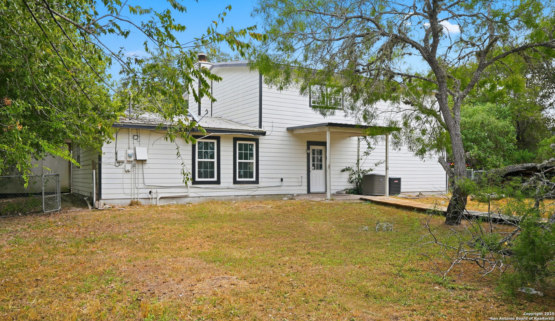 807 Northeast Frontage Road Beeville, TX 78102 - Photo 37 of 49 a house that has a tree in front of it