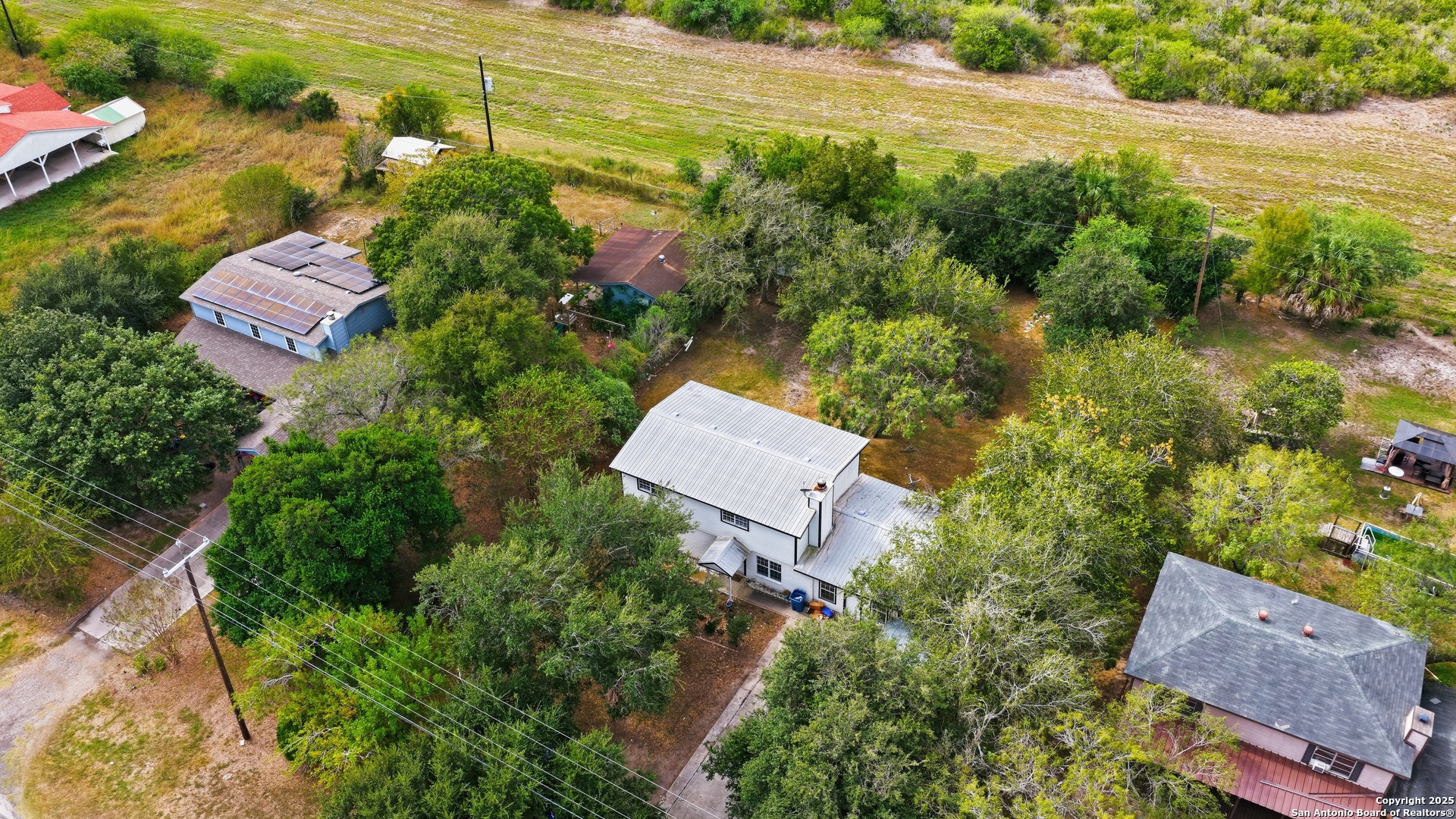 807 Northeast Frontage Road Beeville, TX 78102 - Photo 47 of 49 an aerial view of a house with a yard and lake view