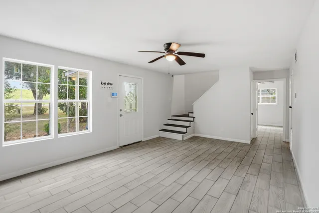 a view of an empty room with a window