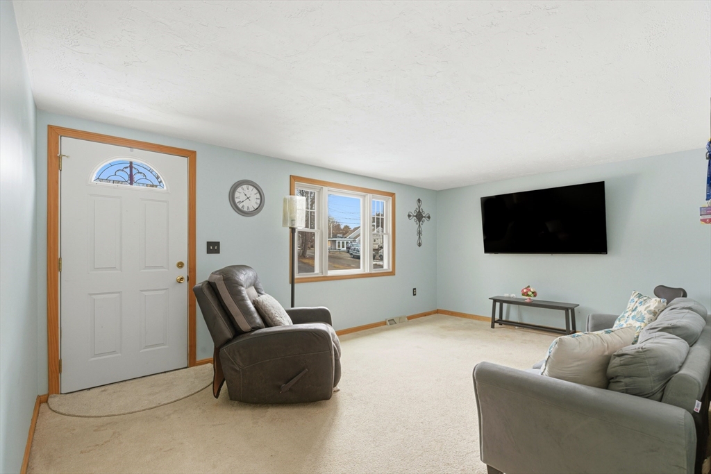10 Wapping Road Kingston, MA 02364 - Photo 2 of 21 a living room with furniture and a flat screen tv