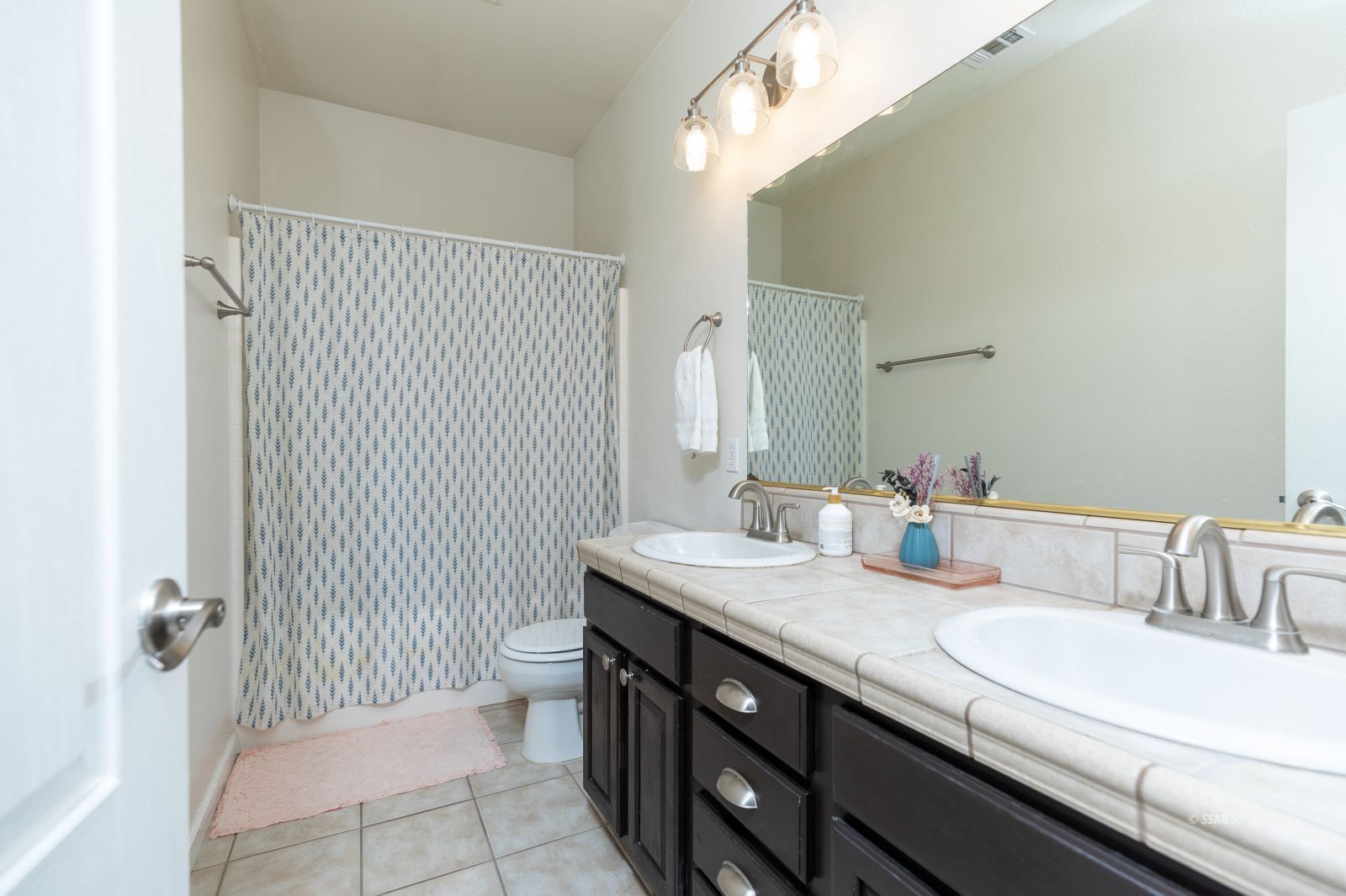 648 Pinon Court Ridgecrest, CA 93555 - Photo 28 of 35 a bathroom with a sink a toilet and shower