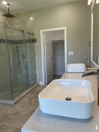 a bathroom with a tub and shower