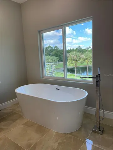 a white bath tub sitting in a bathroom