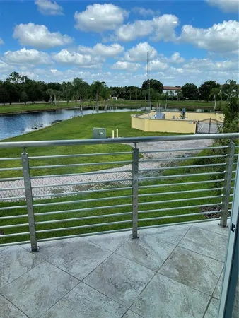 a view of a lake with a houses in the background