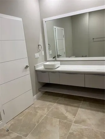 a bathroom with a bathtub and a sink