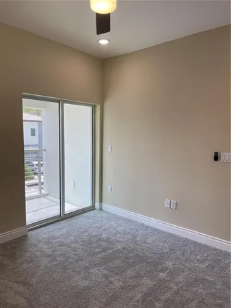 an empty room with glass door