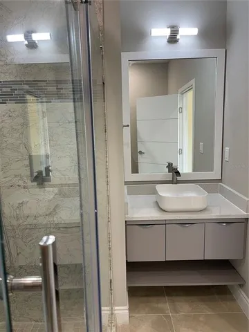 a bathroom with a sink and a mirror