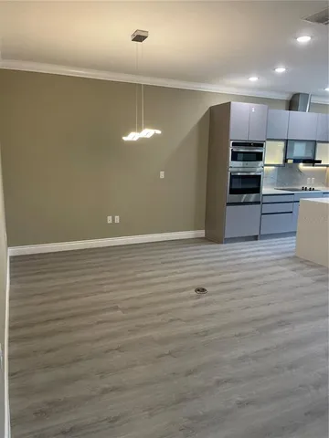 a view of kitchen with cabinets