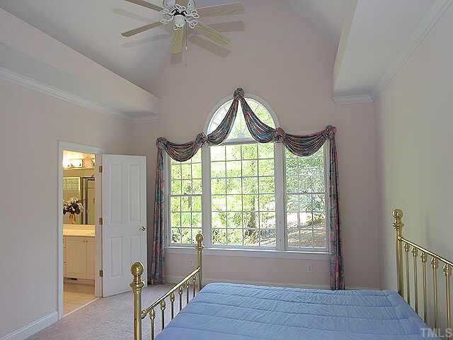2308 Primrose Valley Court Raleigh, NC 27613 - Photo 6 of 12 a bedroom with a bed and a window