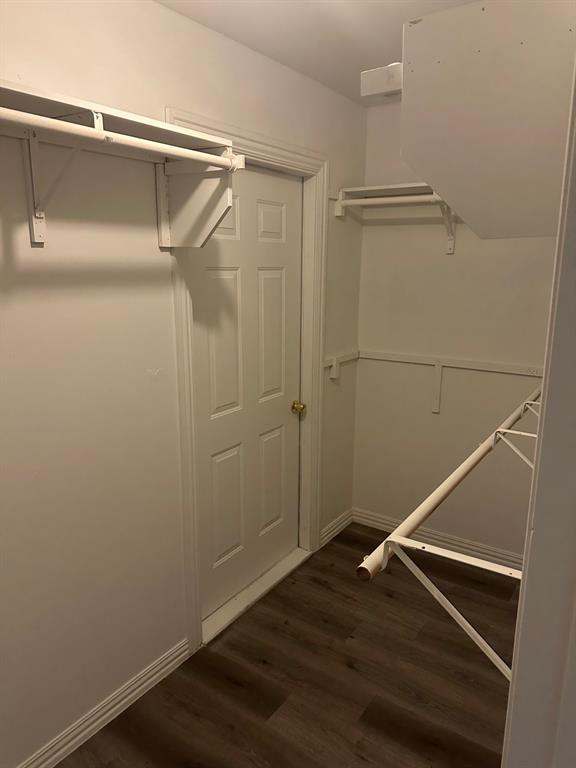 8280 Highway 78 Blue Ridge, TX 75424 - Photo 14 of 21 Walk in closet with dark wood finished floors