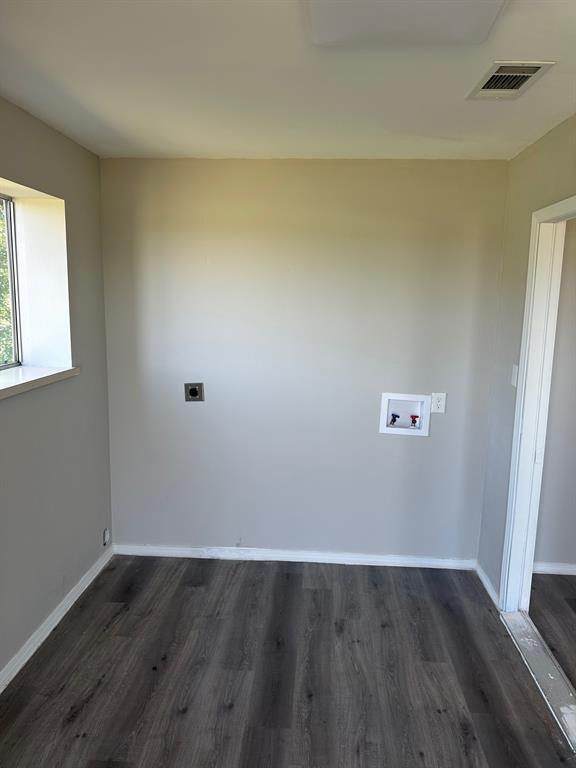 8280 Highway 78 Blue Ridge, TX 75424 - Photo 17 of 21 Laundry area featuring dark wood-type flooring, hookup for an electric dryer, and washer hookup