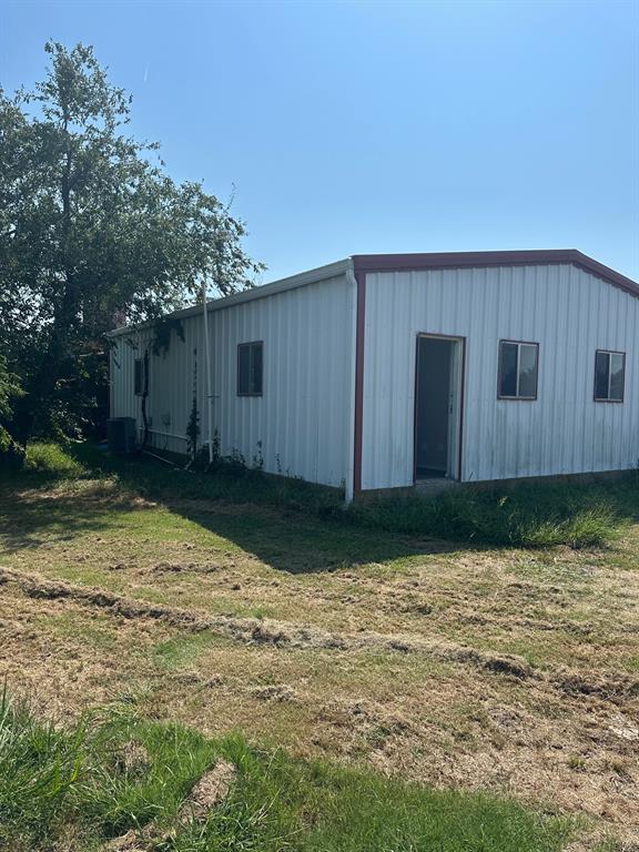 8280 Highway 78 Blue Ridge, TX 75424 - Photo 21 of 21 View of pole building with a lawn