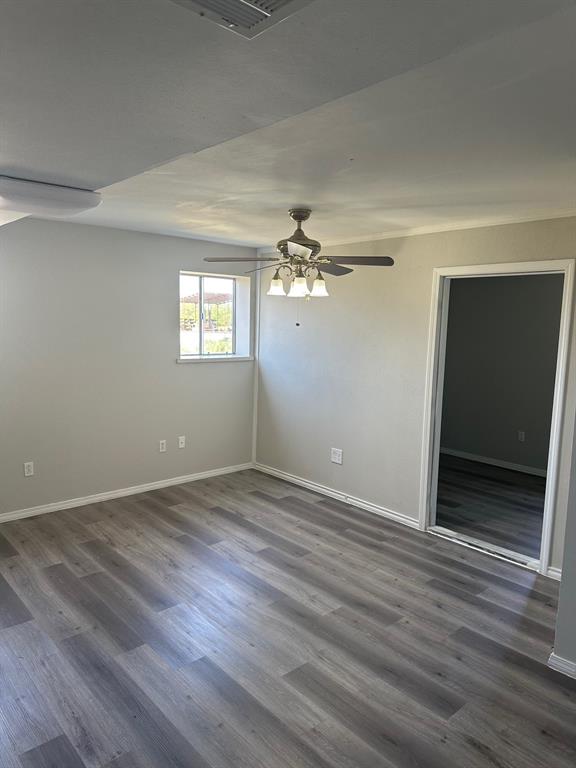 8280 Highway 78 Blue Ridge, TX 75424 - Photo 8 of 21 Empty room featuring dark wood-style flooring