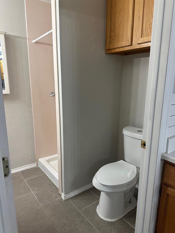 8280 Highway 78 Blue Ridge, TX 75424 - Photo 10 of 21 Full bathroom with a stall shower, light tile patterned floors, and vanity