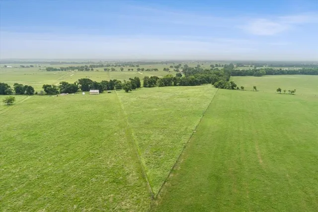 a view of a lake with houses in the back