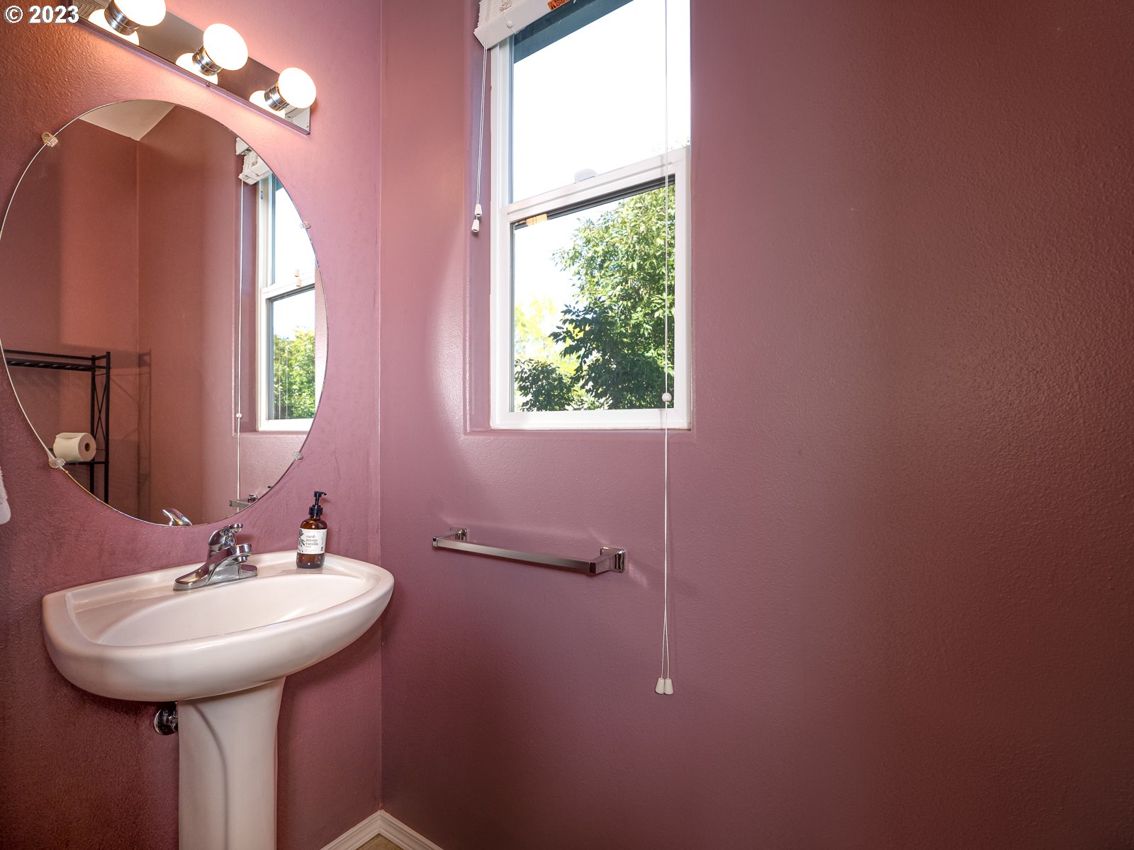 12226 Southeast Long Street Portland, OR 97236 - Photo 15 of 29 a bathroom with a sink a mirror and a window