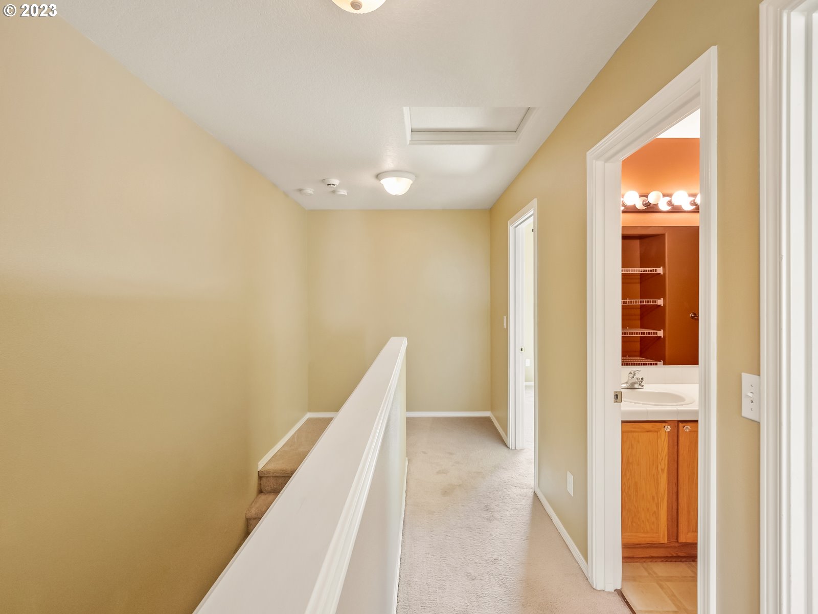 12226 Southeast Long Street Portland, OR 97236 - Photo 18 of 29 a view of a hallway with wooden floor and staircase