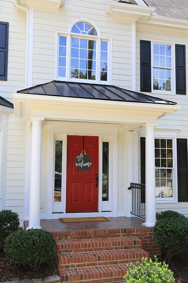 7812 Mayapple Place Raleigh, NC 27613 - Photo 2 of 30 This is a very welcoming porch with tile floor and back railings. Covered Front Porch