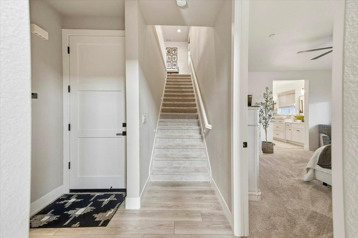 508 Chase Court Colfax, CA 95713 - Photo 14 of 34 a view of a hallway view with wooden floor and staircase