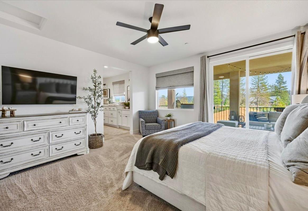 508 Chase Court Colfax, CA 95713 - Photo 16 of 34 a spacious bedroom with a large bed and a flat screen tv