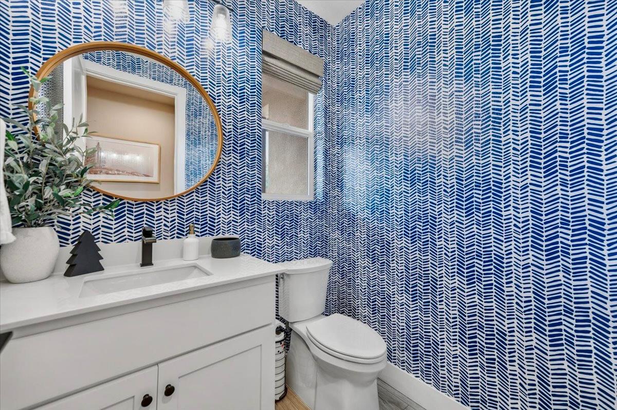 508 Chase Court Colfax, CA 95713 - Photo 21 of 34 a bathroom with a toilet sink vanity and mirror