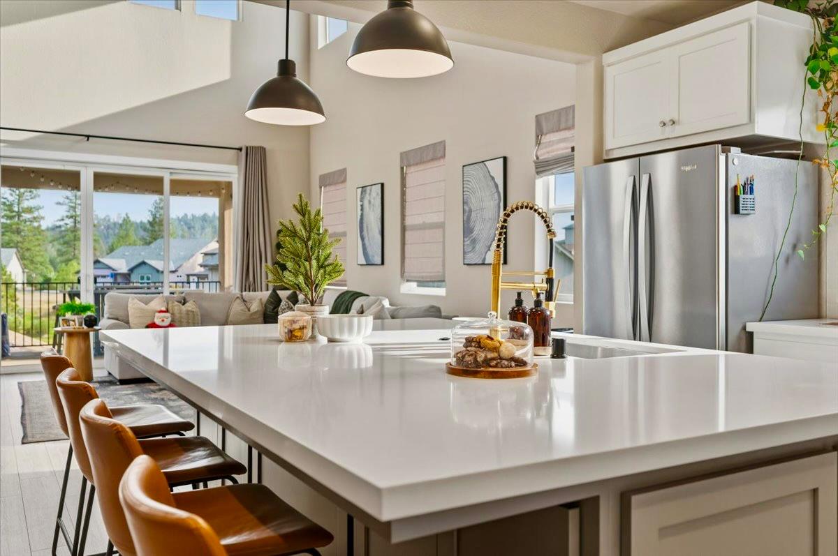 508 Chase Court Colfax, CA 95713 - Photo 8 of 34 a kitchen with stainless steel appliances granite countertop a sink and a refrigerator