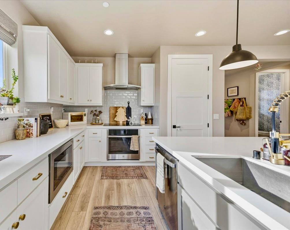 508 Chase Court Colfax, CA 95713 - Photo 10 of 34 a kitchen with a sink stove and refrigerator