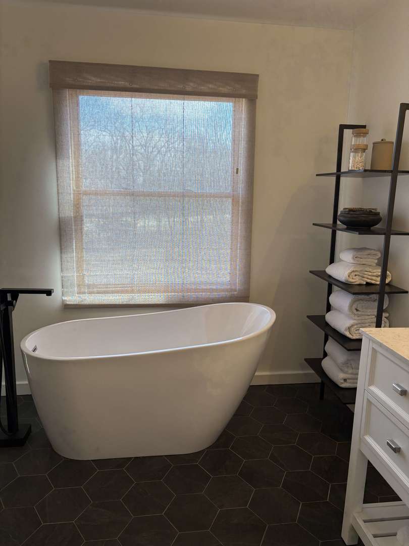 1124 North Clark Lane Elizabeth, IL 61028 - Photo 13 of 50 a white bath tub sitting next to a blue sink