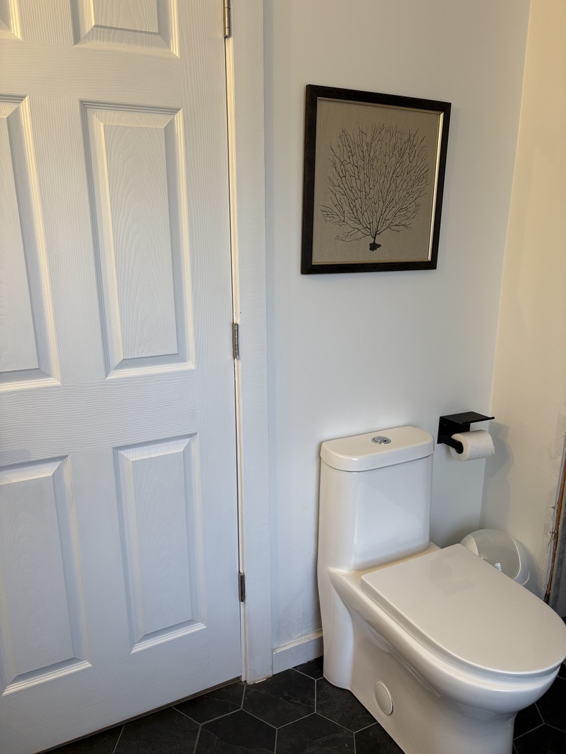 1124 North Clark Lane Elizabeth, IL 61028 - Photo 14 of 50 a white toilet sitting next to a bathroom sink