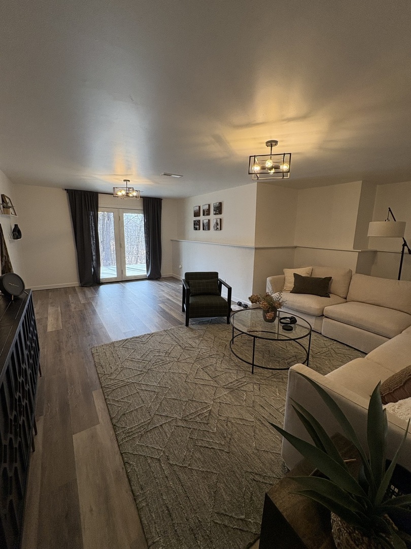 1124 North Clark Lane Elizabeth, IL 61028 - Photo 23 of 50 a living room with furniture and a lamp