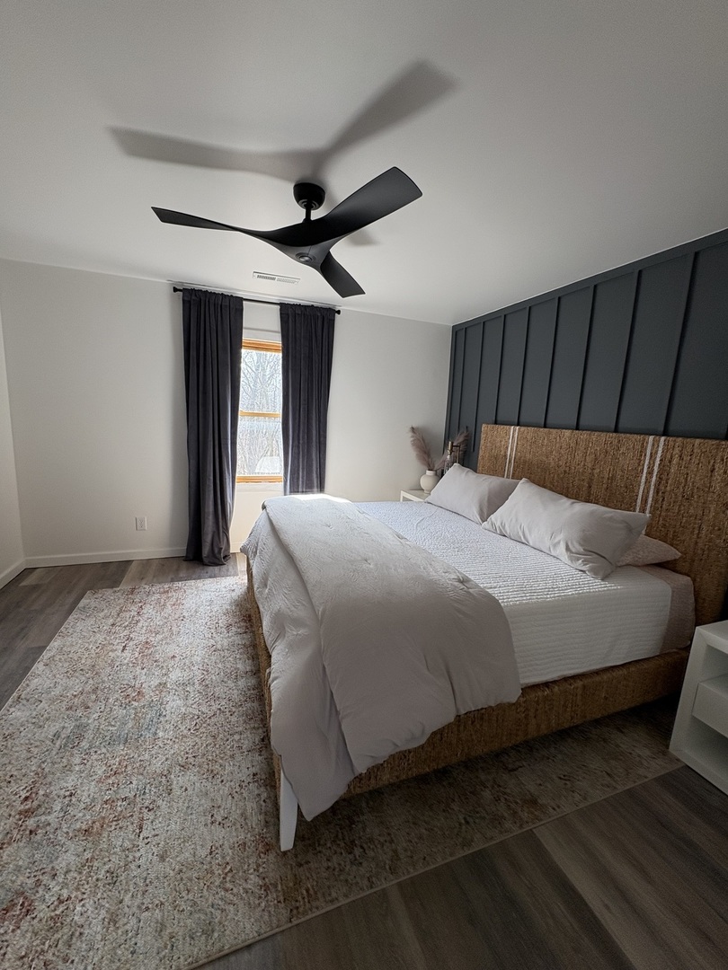 1124 North Clark Lane Elizabeth, IL 61028 - Photo 10 of 50 a bedroom with a large bed and a ceiling fan