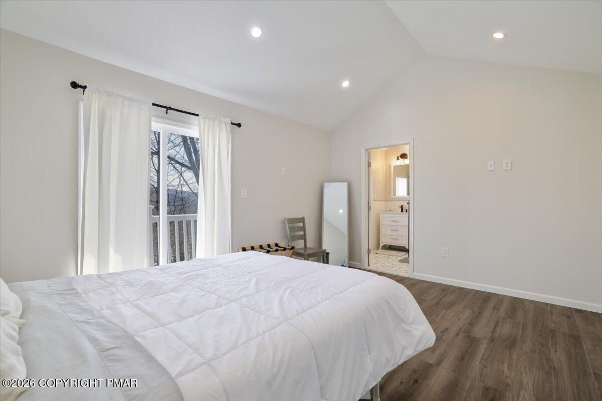 5873 Decker Road Bushkill, PA 18324 - Photo 9 of 57 a spacious bedroom with a bed and a window