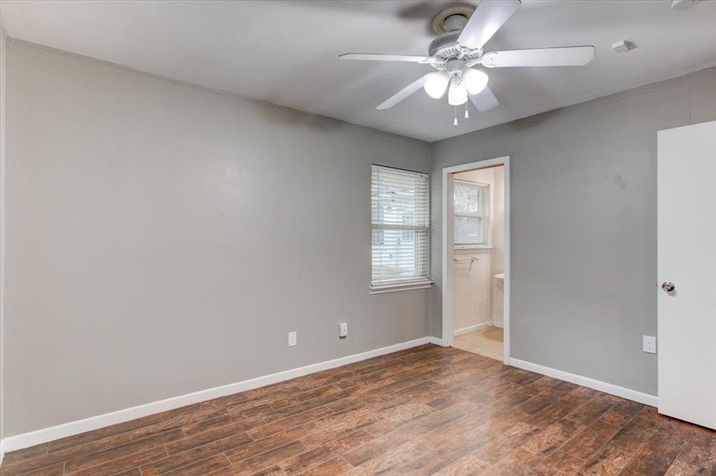 3558 Winston Road Fort Worth, TX 76109 - Photo 13 of 24 wooden floor in an empty room with a window
