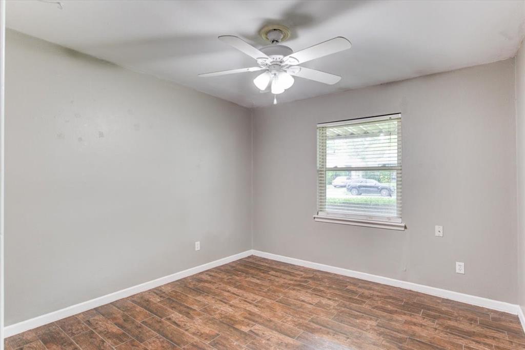 3558 Winston Road Fort Worth, TX 76109 - Photo 14 of 24 an empty room with windows and fan